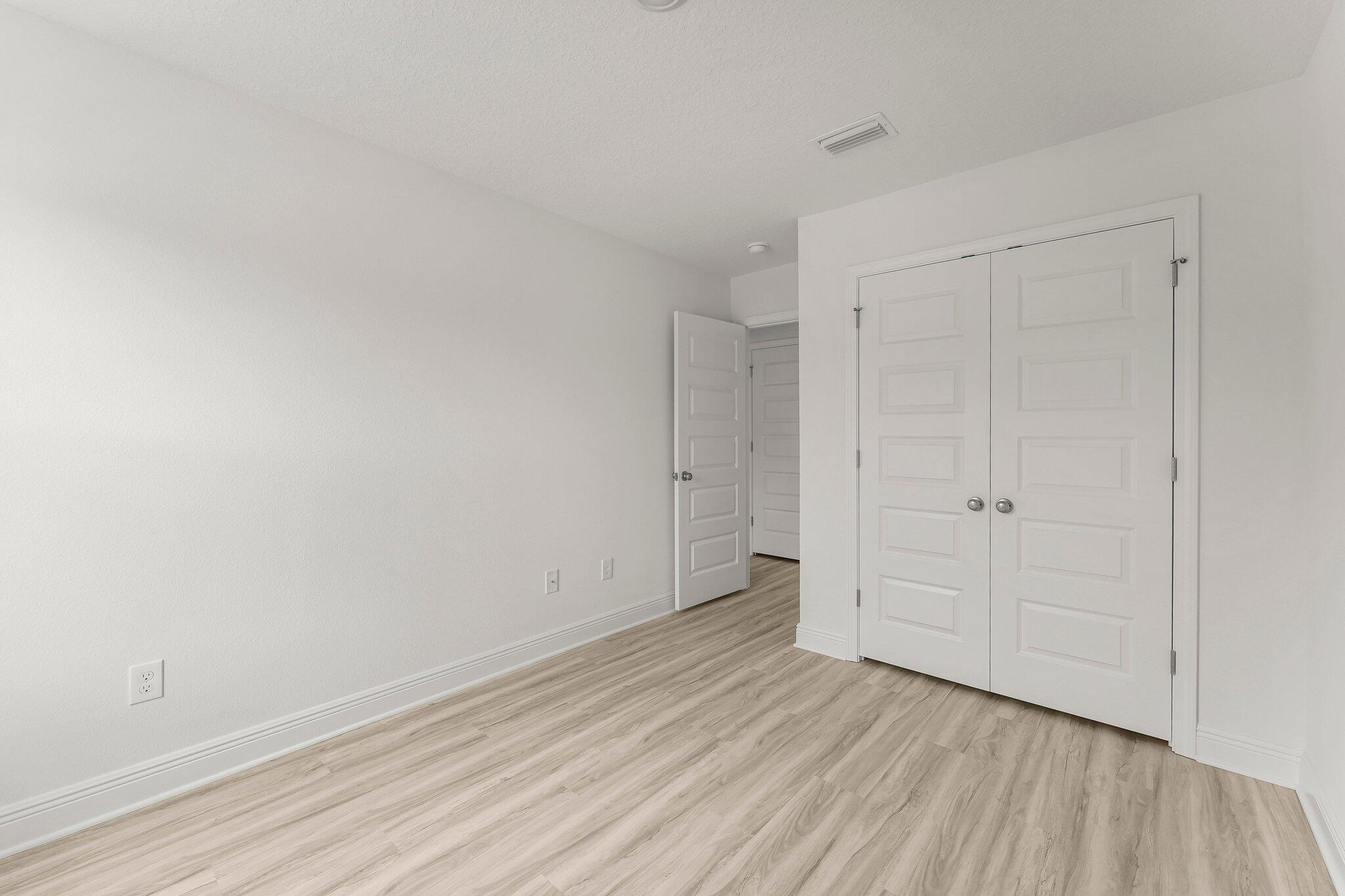 48 Hawk Street Santa Rosa Beach, FL 32459 - Photo 30 of 34 a view of an empty room and wooden floor