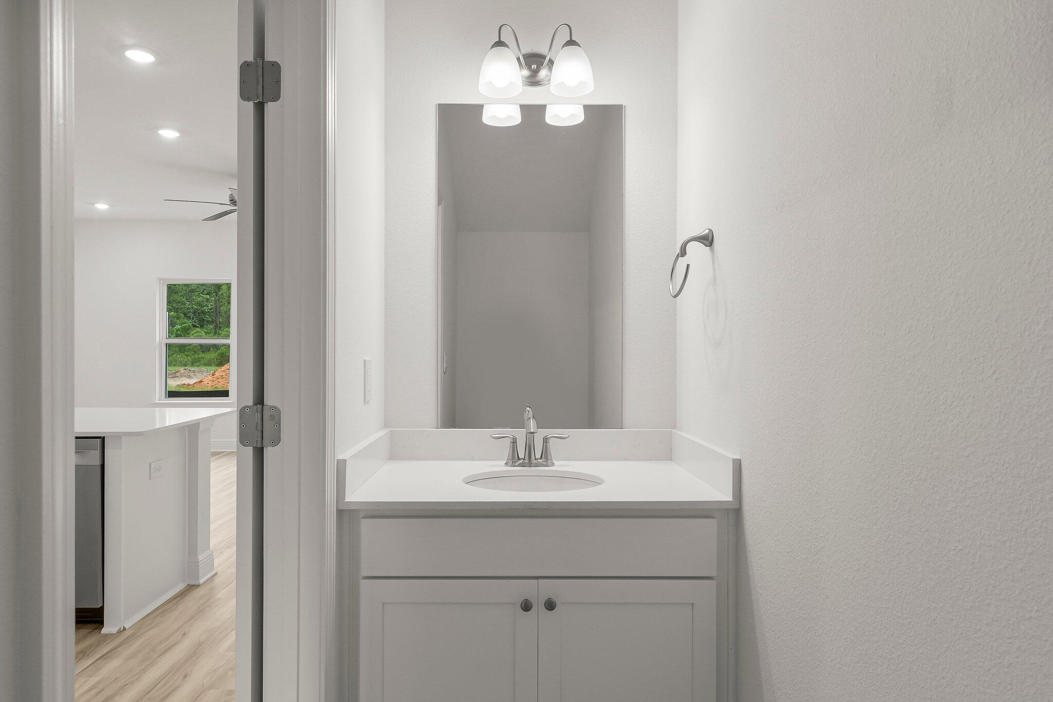 48 Hawk Street Santa Rosa Beach, FL 32459 - Photo 10 of 34 a bathroom with a sink and a mirror