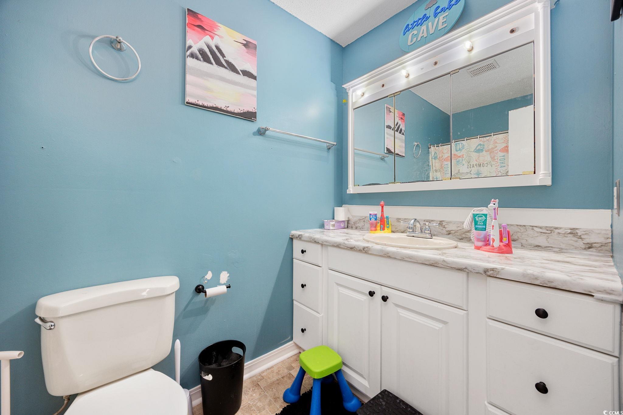 755 Burcale Road, Unit F4 Myrtle Beach, SC 29579 - Photo 23 of 30 Full bathroom featuring vanity and toilet