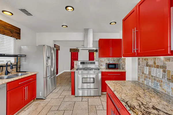 a bedroom with furniture and a flat screen tv