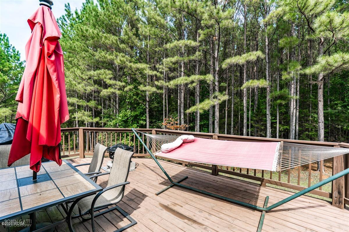 873 Blue Store Road Forsyth, GA 31029 - Photo 22 of 25 a view of sitting area with furniture and wooden deck