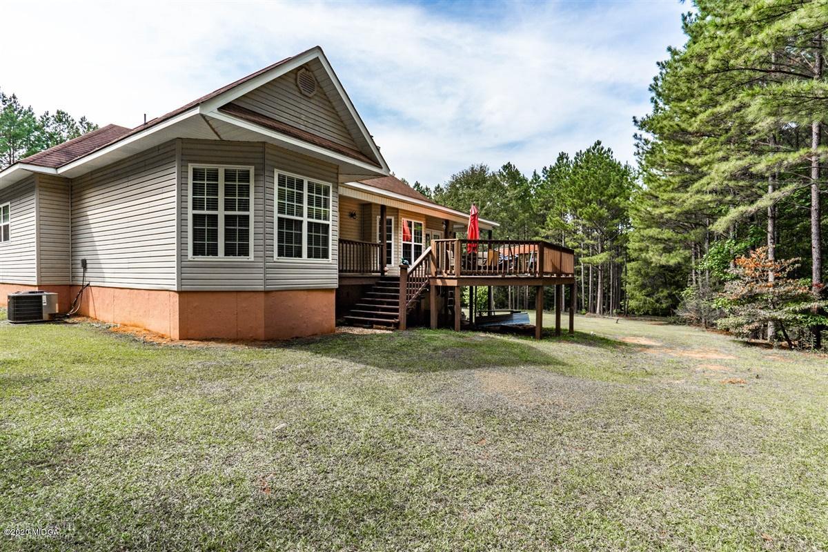 873 Blue Store Road Forsyth, GA 31029 - Photo 23 of 25 a front view of a house with a yard