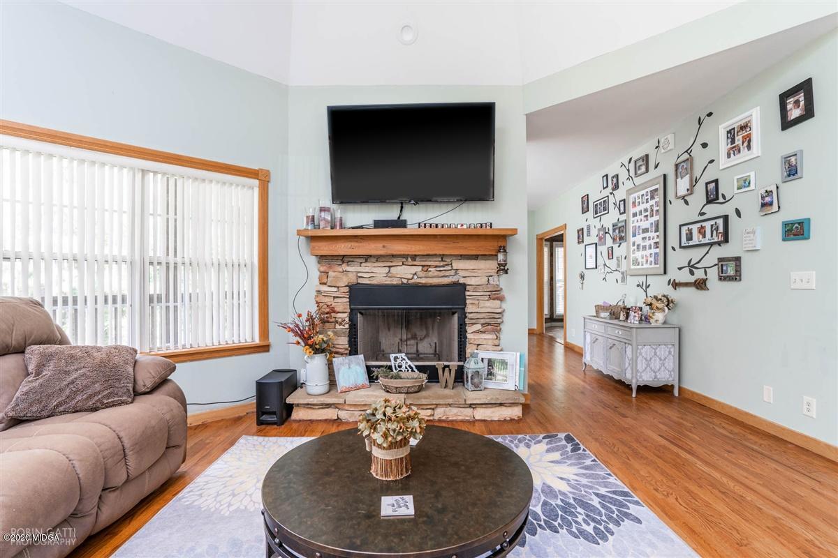 873 Blue Store Road Forsyth, GA 31029 - Photo 6 of 25 a living room with furniture and a fireplace