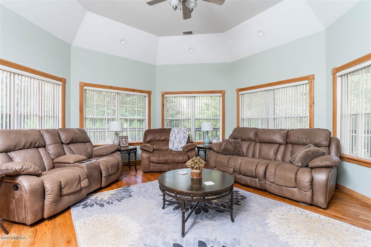 873 Blue Store Road Forsyth, GA 31029 - Photo 7 of 25 a living room with furniture and a large window