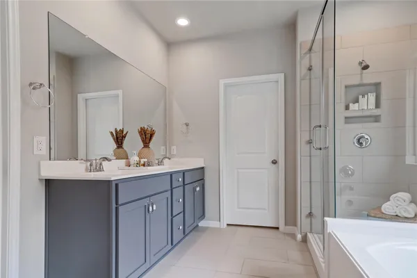a bathroom with a bathtub and a sink