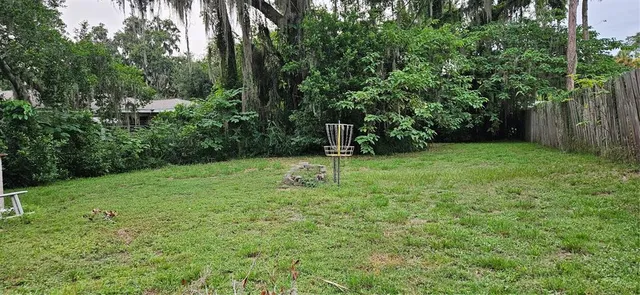 a backyard of a house with lots of green space