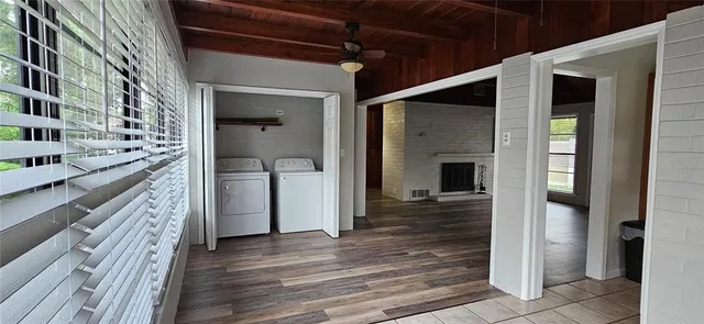 a view of a hallway view with wooden floor and staircase