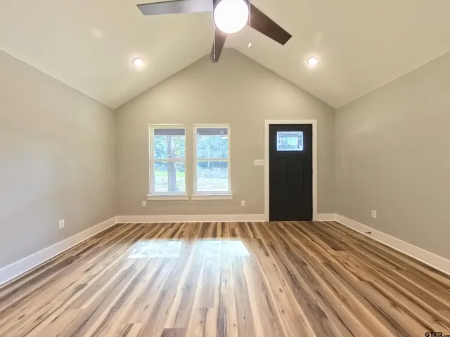 a view of an empty room with a window