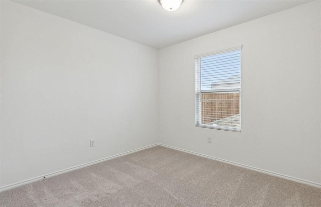 820 Lake Fletcher Road Princeton, TX 75407 - Photo 11 of 15 an empty room with a window