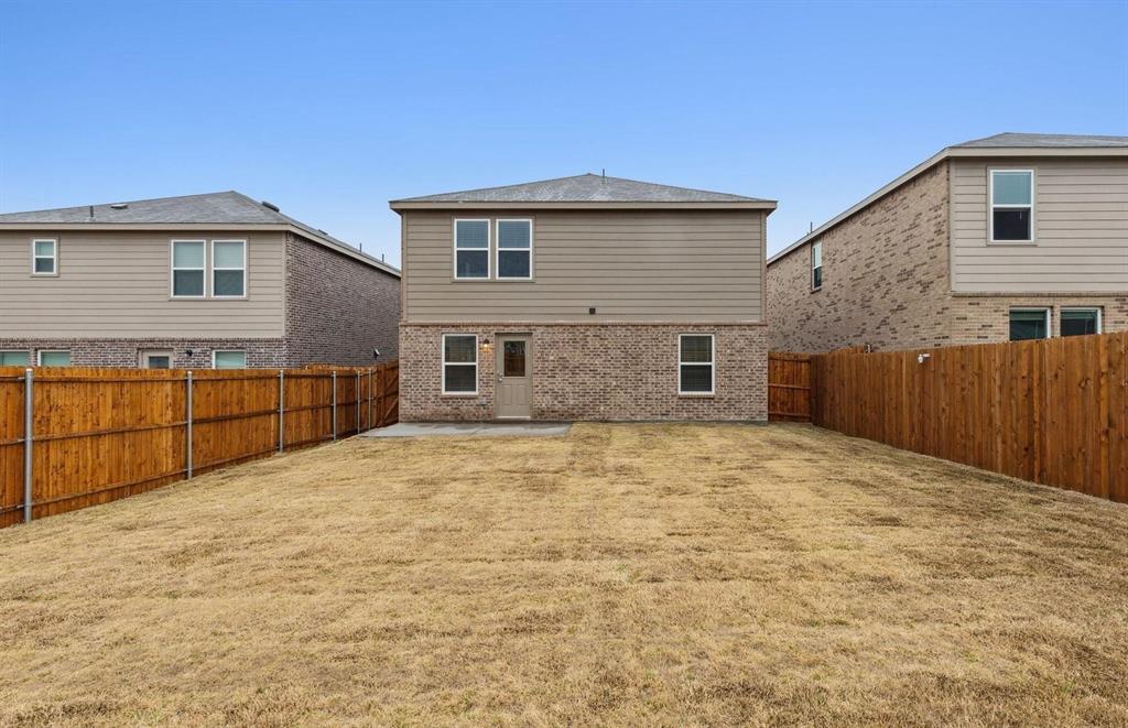 820 Lake Fletcher Road Princeton, TX 75407 - Photo 2 of 15 a backyard of a house