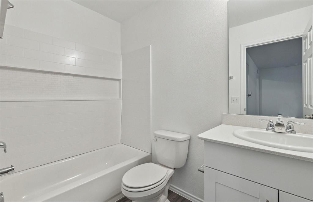 820 Lake Fletcher Road Princeton, TX 75407 - Photo 4 of 15 a bathroom with a sink a toilet and shower