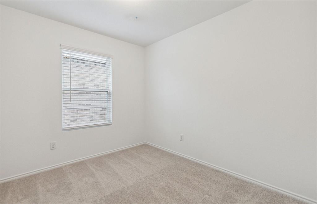 820 Lake Fletcher Road Princeton, TX 75407 - Photo 5 of 15 an empty room with a window