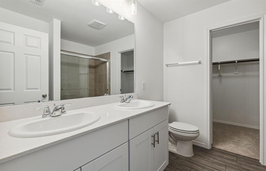 820 Lake Fletcher Road Princeton, TX 75407 - Photo 7 of 15 a bathroom with a sink toilet and shower