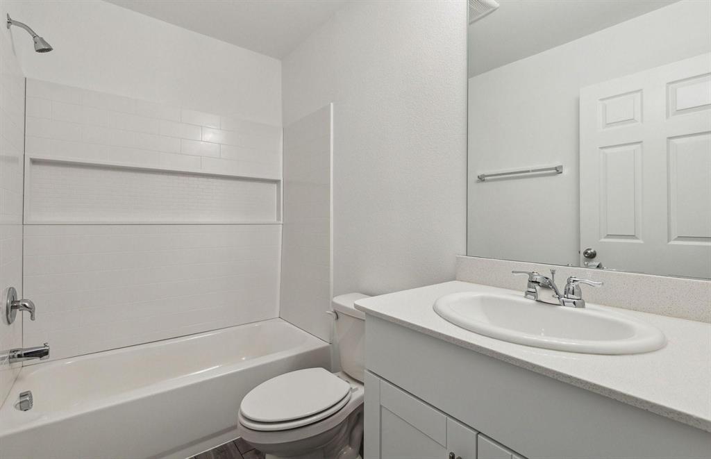 820 Lake Fletcher Road Princeton, TX 75407 - Photo 10 of 15 a bathroom with a sink toilet and shower