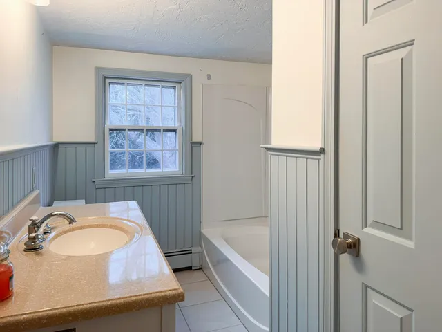 a bathroom with a sink and a bathtub