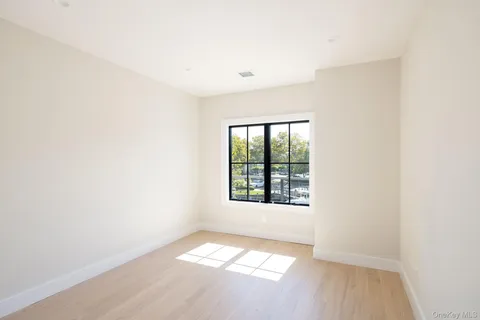 a bathroom with a granite countertop sink a toilet and a shower