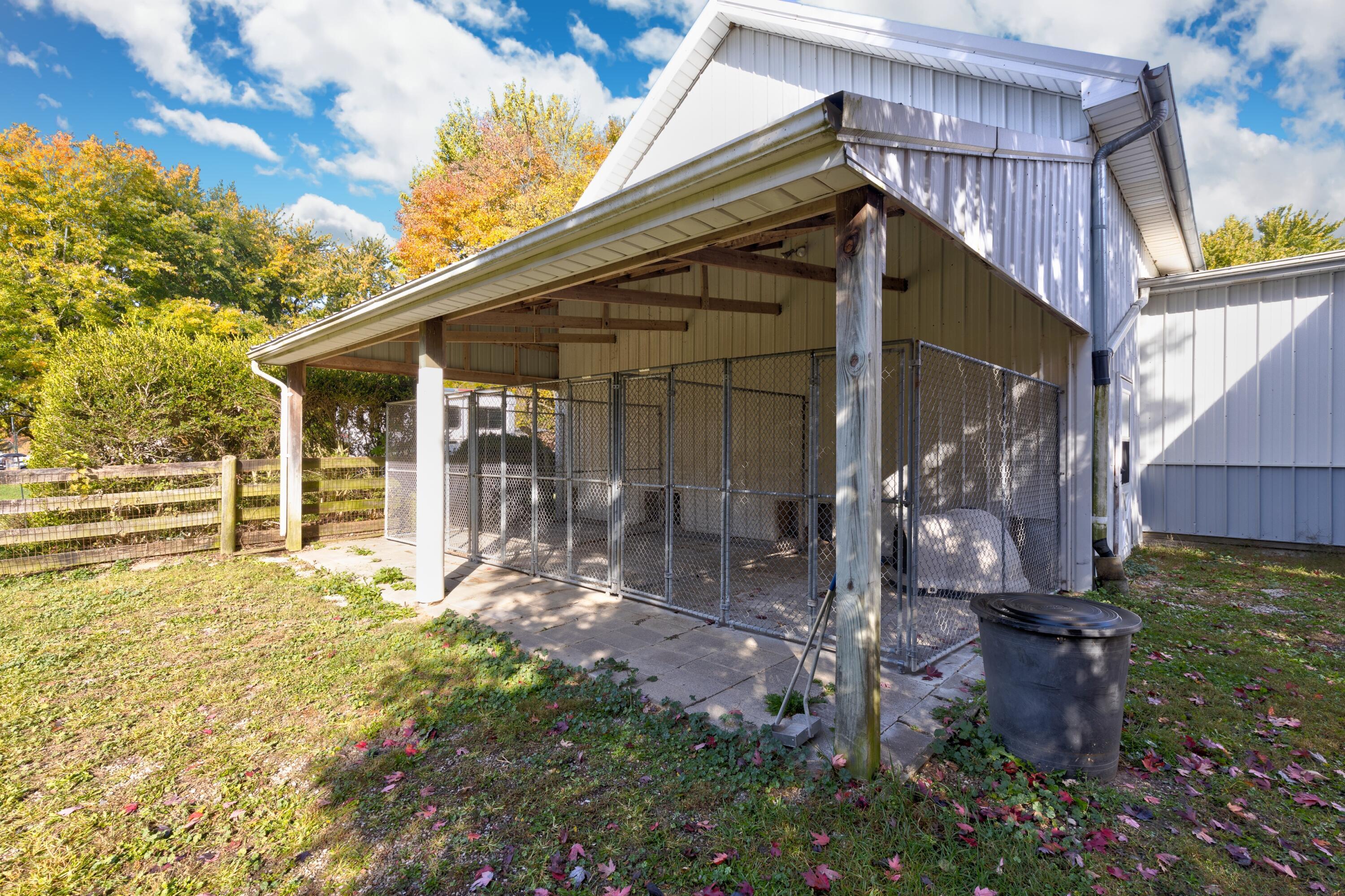 6681 Harlem Road Westerville, OH 43082 - Photo 63 of 78 • Concrete floor • Kennels do not convey • Ceiling fans • Insulated • Water and electric (tied to house) • Utilty sink • Front and rear door • Covered patio area • Hasel door to Barn • Dog kennel fencing does not remain