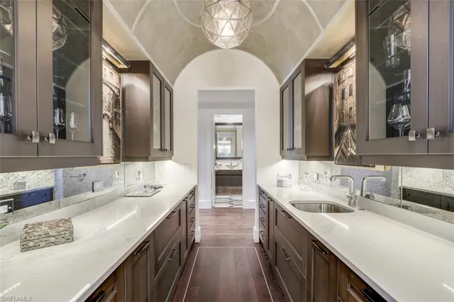 a en suite bathroom with double vanity sinks and a mirror