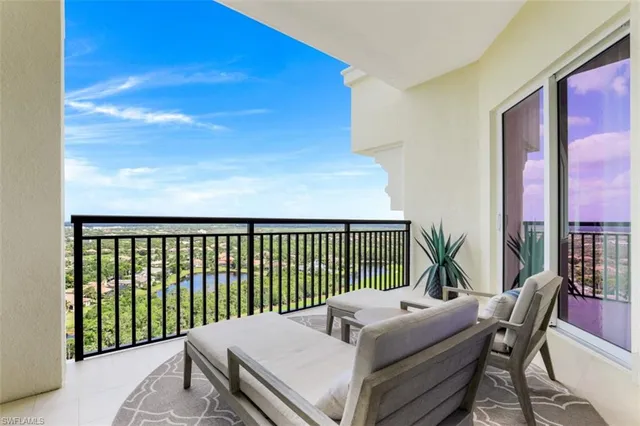 a balcony with chairs