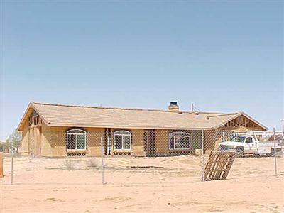 11820 Morning Star Road Apple Valley, CA 92308 - Photo 1 of 1 a front view of a house with a yard