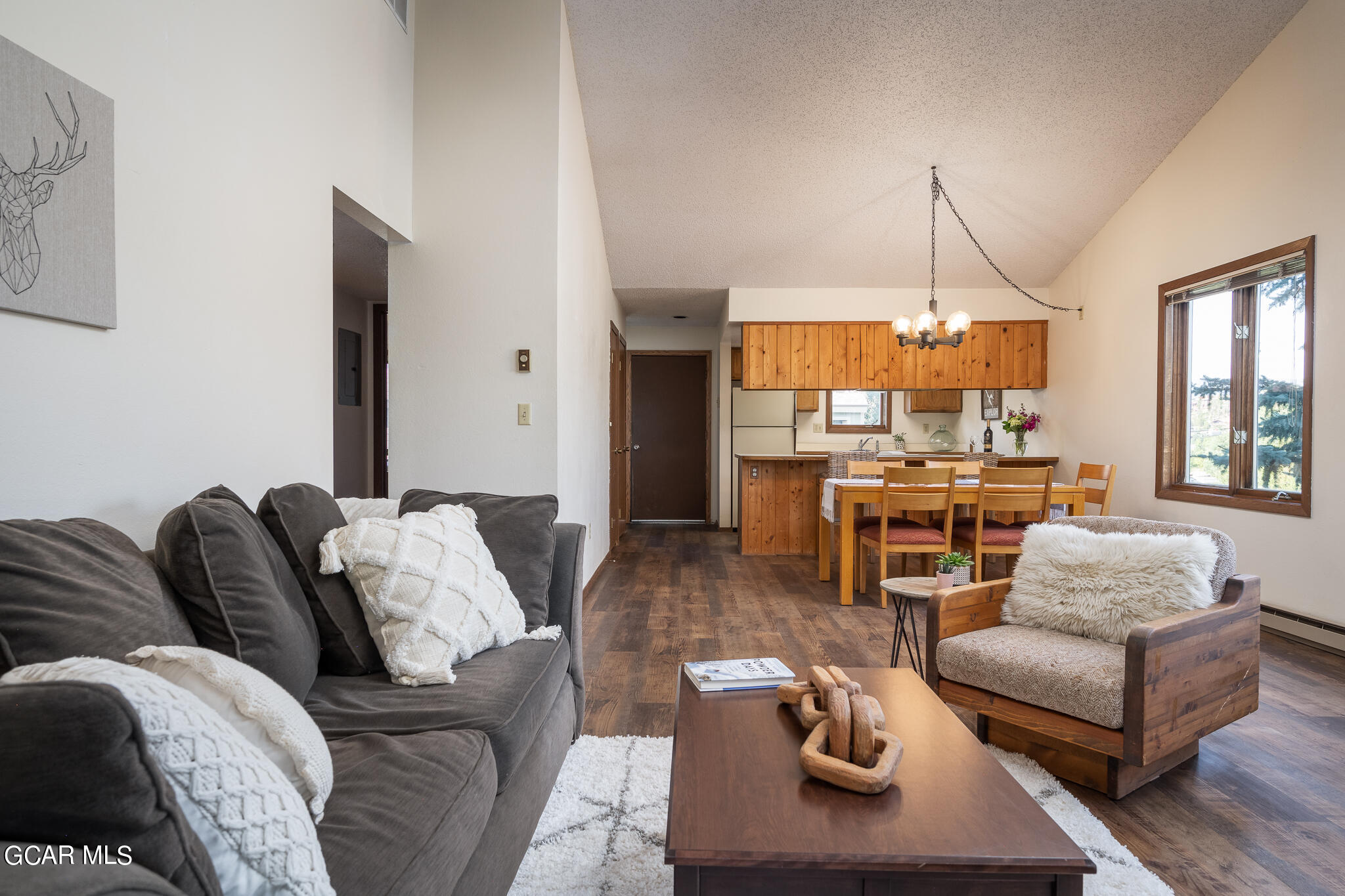 99 Doc Susie Avenue, Unit B6 Fraser, CO 80442 - Photo 11 of 24 a living room with furniture and a wooden floor