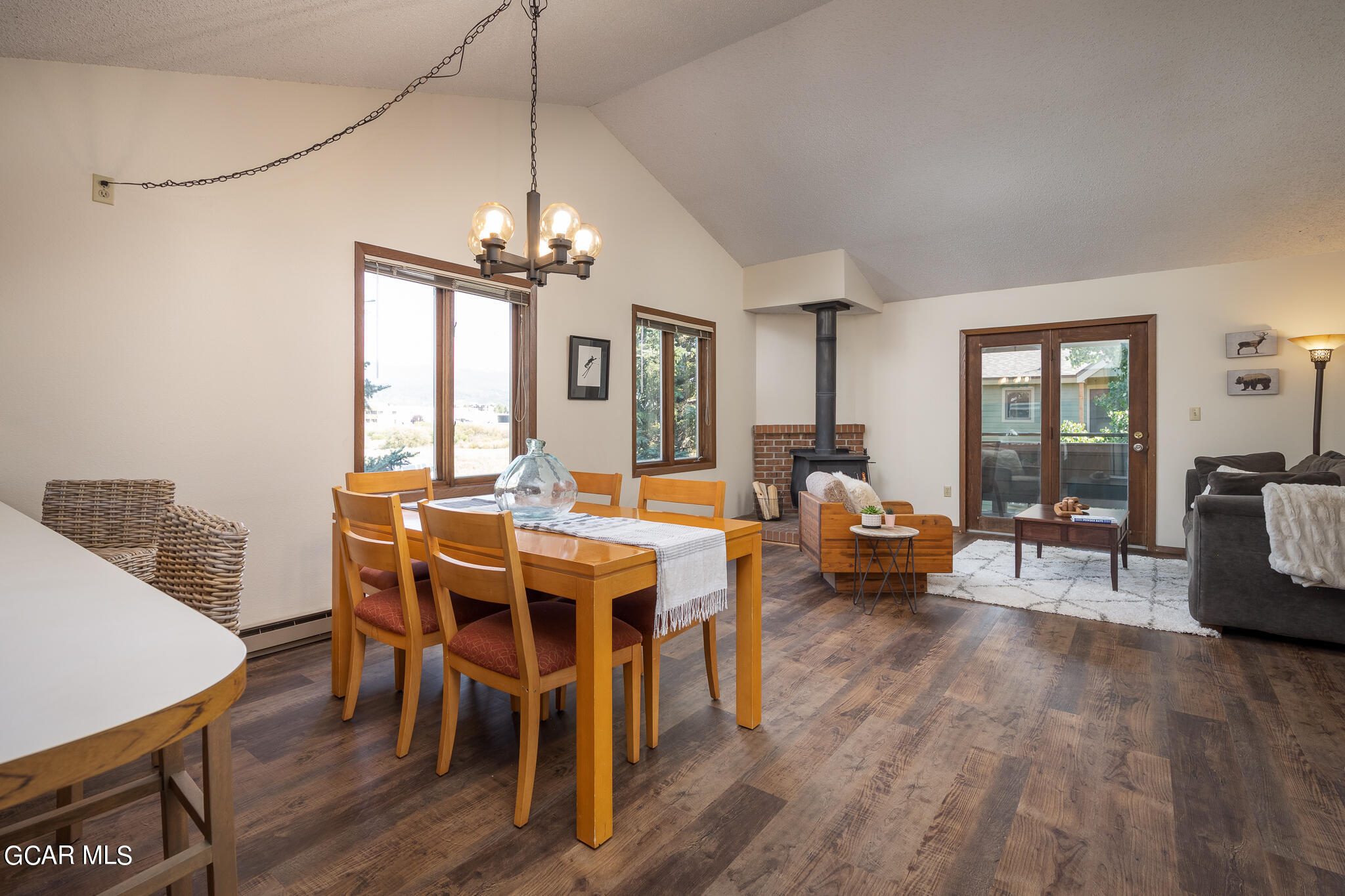 99 Doc Susie Avenue, Unit B6 Fraser, CO 80442 - Photo 16 of 24 a view of a dining room with furniture window and wooden floor