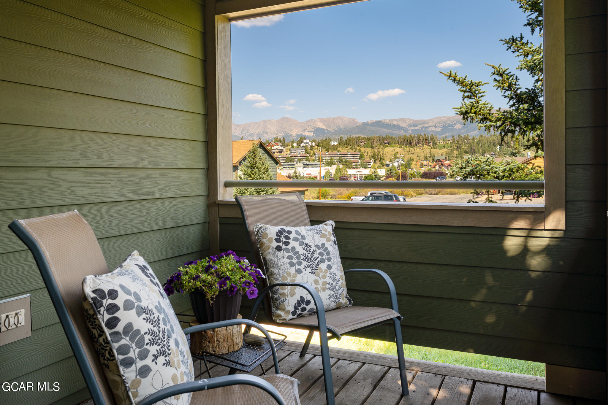 99 Doc Susie Avenue, Unit B6 Fraser, CO 80442 - Photo 2 of 24 a balcony with furniture and a potted plant