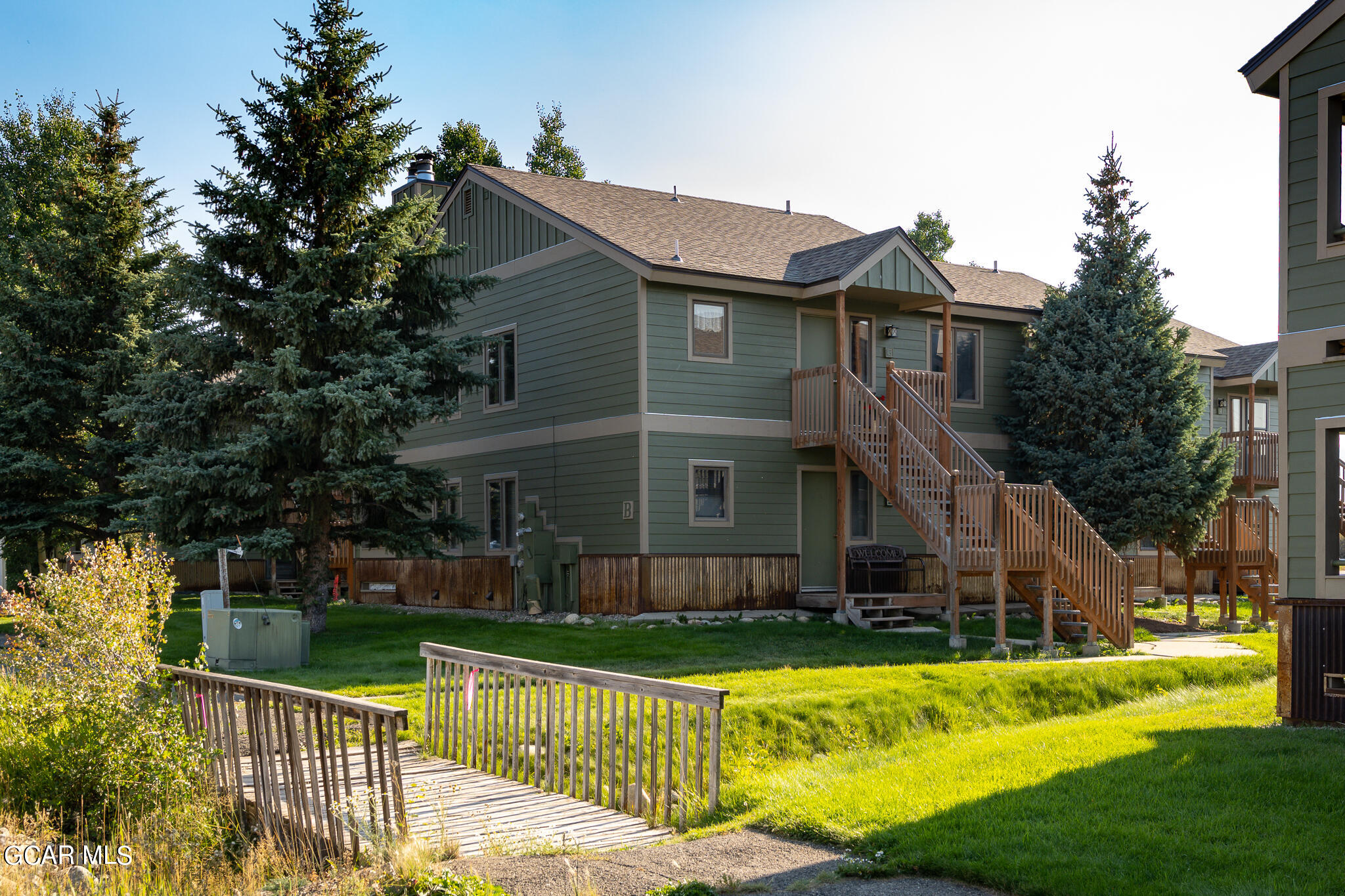 99 Doc Susie Avenue, Unit B6 Fraser, CO 80442 - Photo 24 of 24 a front view of house with yard and green space