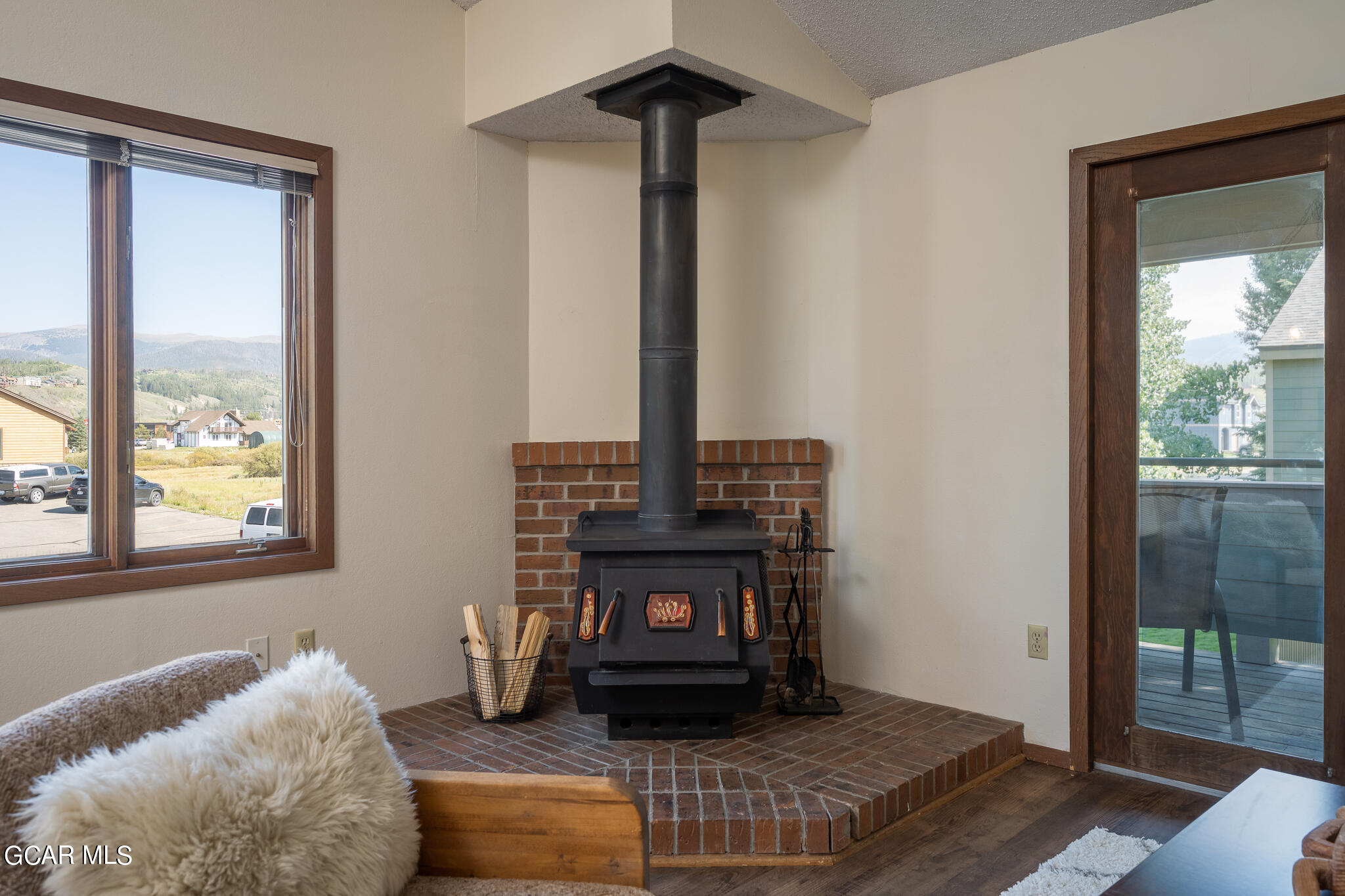 99 Doc Susie Avenue, Unit B6 Fraser, CO 80442 - Photo 4 of 24 a living room with furniture and a fireplace