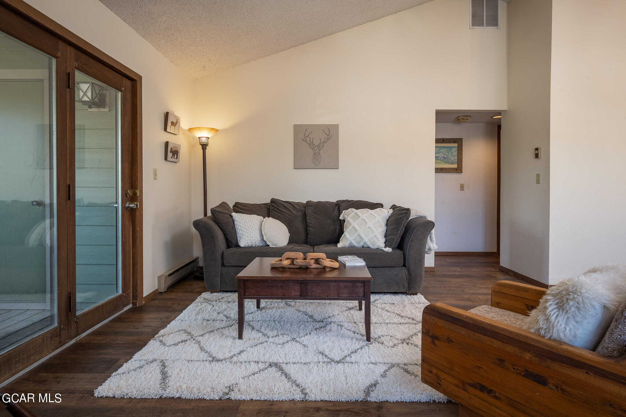 99 Doc Susie Avenue, Unit B6 Fraser, CO 80442 - Photo 5 of 24 a living room with furniture and a rug