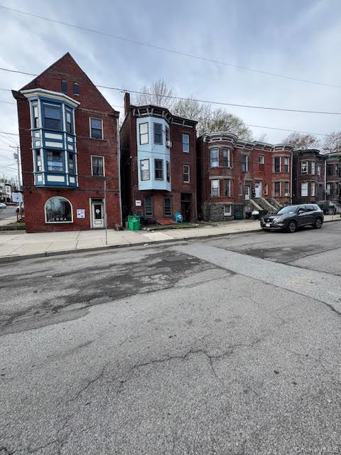 95 Renwick Street Newburgh, NY 12550 - Photo 16 of 24 a view of a street that has couple of cars parked on the road