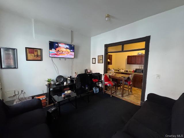 95 Renwick Street Newburgh, NY 12550 - Photo 6 of 24 a living room with furniture and a flat screen tv