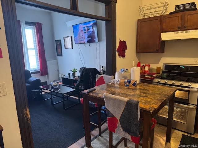 95 Renwick Street Newburgh, NY 12550 - Photo 9 of 24 a dining room with furniture and wooden floor