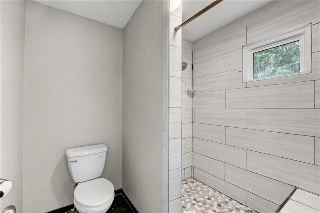 2610 Loring Road Northwest Kennesaw, GA 30152 - Photo 17 of 28 a bathroom with a toilet