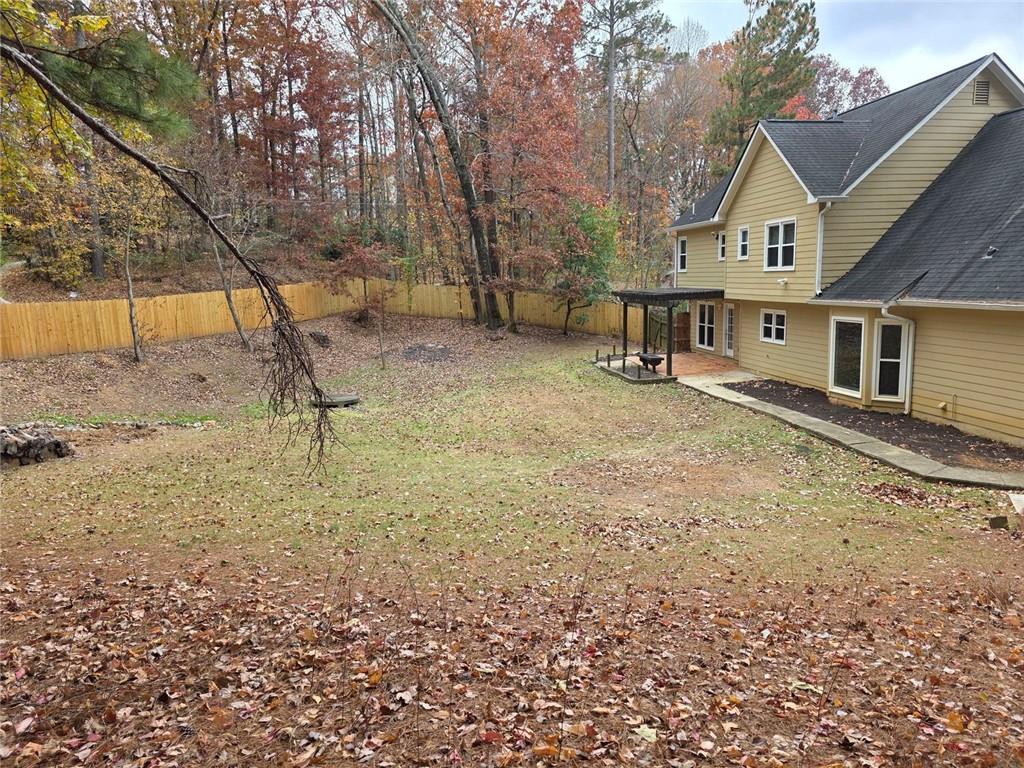2610 Loring Road Northwest Kennesaw, GA 30152 - Photo 24 of 28 a view of a house with a yard
