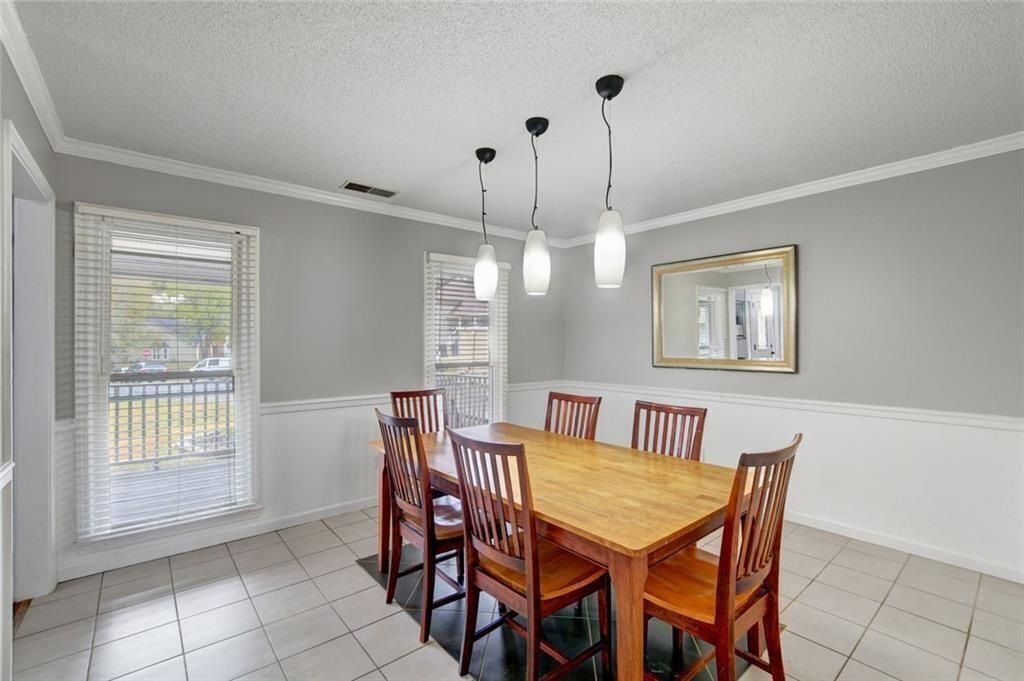 2610 Loring Road Northwest Kennesaw, GA 30152 - Photo 8 of 28 a dining room with furniture and window