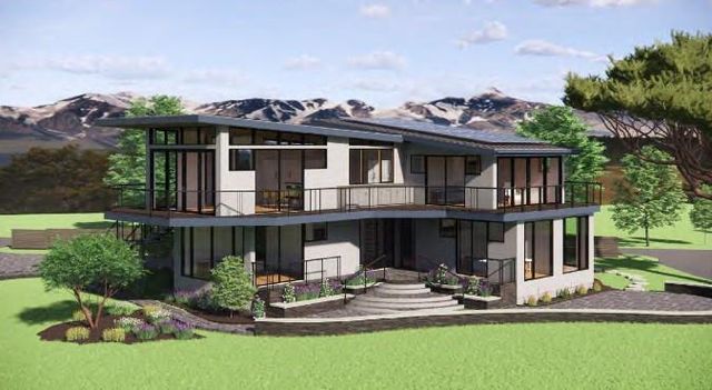 a front view of a house with a yard table and chairs