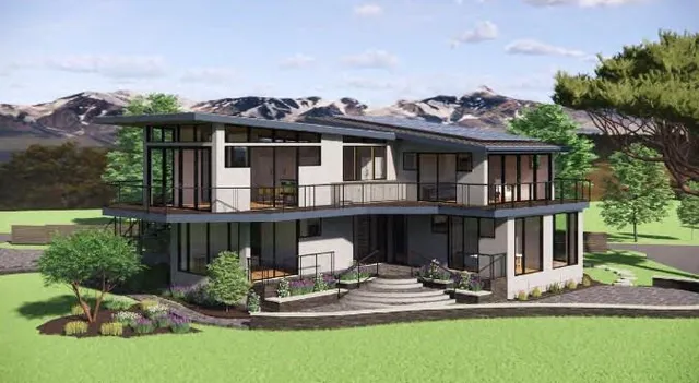 a front view of a house with a yard table and chairs