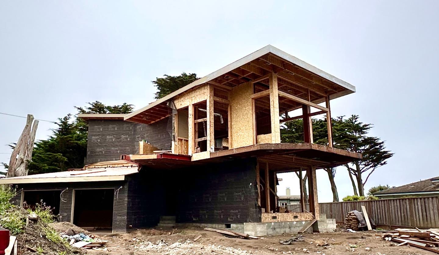 155 Reef Point Road Moss Beach, CA 94038 - Photo 7 of 9 a front view of house with yard