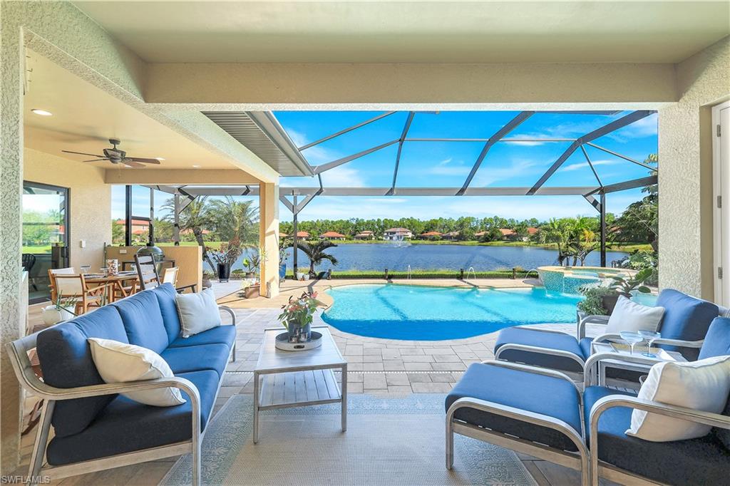 1456 Mockingbird Drive Naples, FL 34120 - Photo 16 of 43 View of pool featuring outdoor lounge area, a patio area, a pool with connected hot tub, a sunroom, and ceiling fan