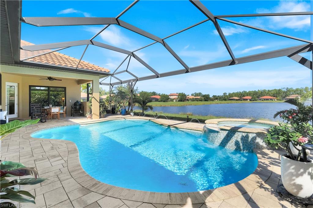 1456 Mockingbird Drive Naples, FL 34120 - Photo 2 of 43 View of pool featuring panoramic screen for unobstructed water view, spa w/ waterfall. Outdoor dining area plumbed for outdoor Kitchen.