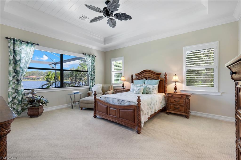 1456 Mockingbird Drive Naples, FL 34120 - Photo 20 of 43 Bedroom with a raised ceiling, light colored carpet, crown molding, and ceiling fan