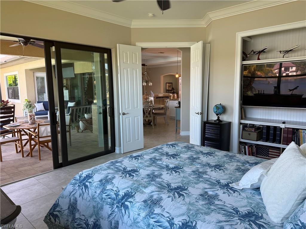 1456 Mockingbird Drive Naples, FL 34120 - Photo 29 of 43 3rd Bedroom with ornamental molding, access to exterior, light tile patterned floors, and ceiling fan