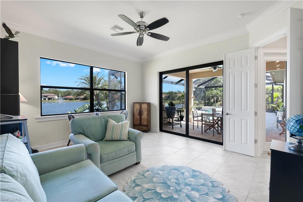 1456 Mockingbird Drive Naples, FL 34120 - Photo 31 of 43 a living room with furniture and a large window