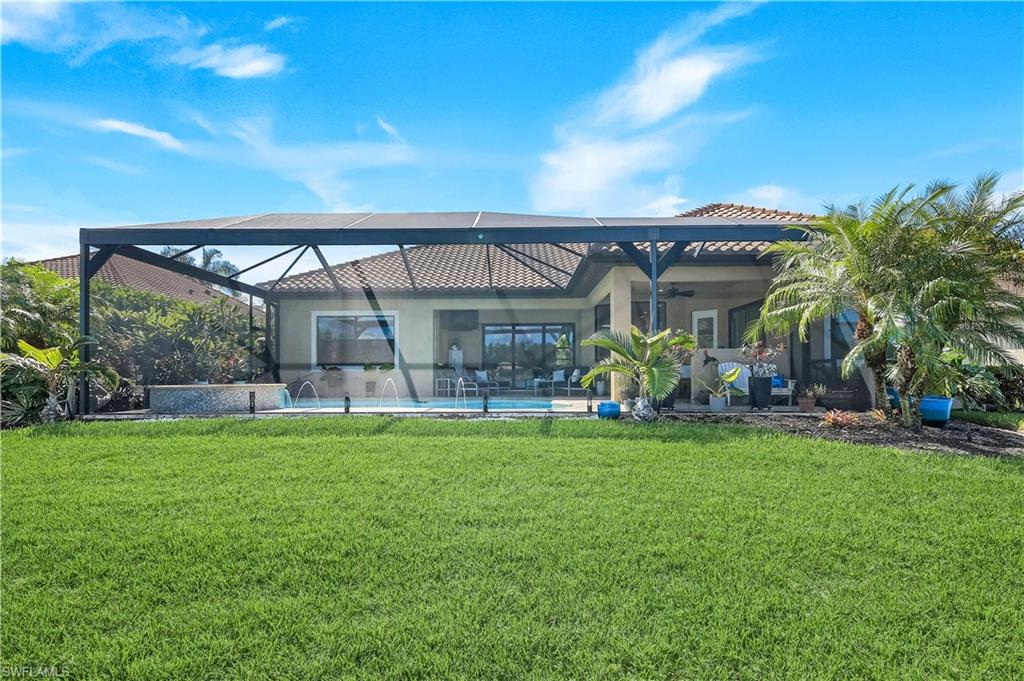 1456 Mockingbird Drive Naples, FL 34120 - Photo 37 of 43 a view of a house with a yard