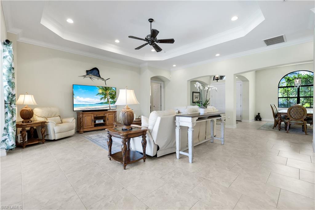 1456 Mockingbird Drive Naples, FL 34120 - Photo 38 of 43 a living room with furniture and a large window