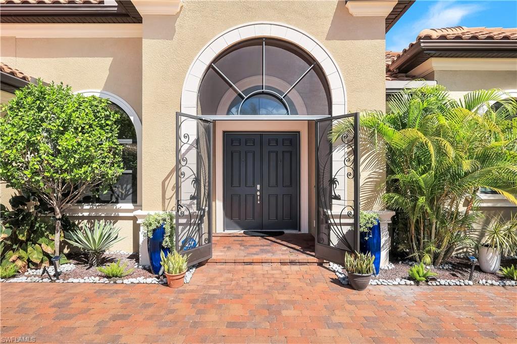 1456 Mockingbird Drive Naples, FL 34120 - Photo 39 of 43 a view of entrance gate of a house