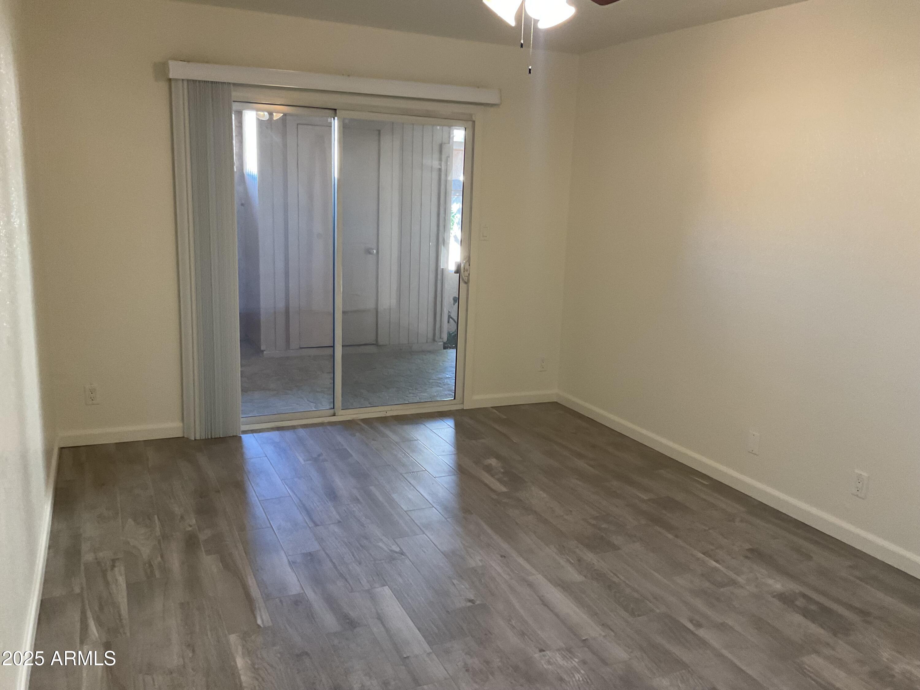 95 North Cooper Road, Unit 75 Chandler, AZ 85225 - Photo 11 of 19 wooden floor in an empty room