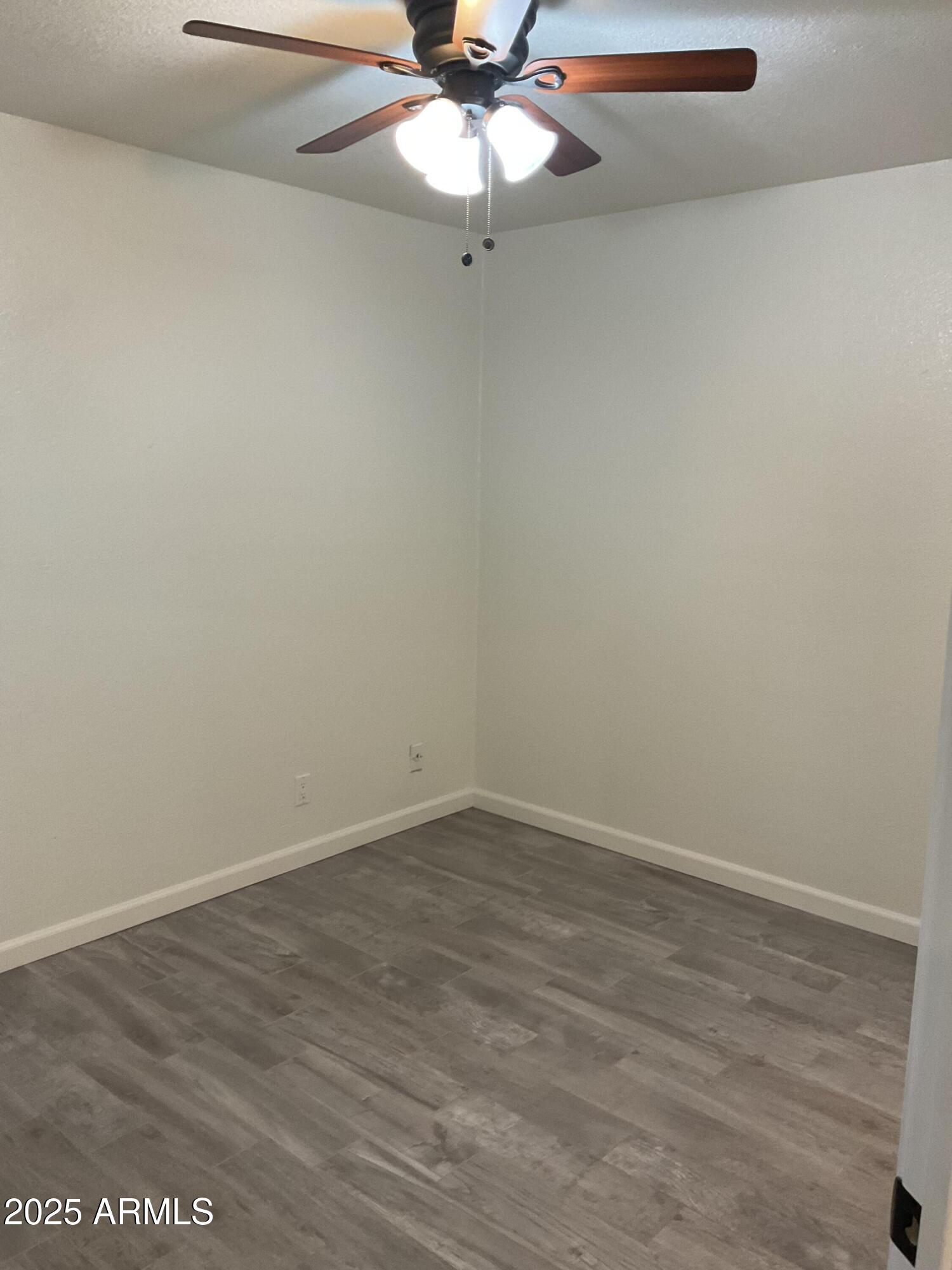 95 North Cooper Road, Unit 75 Chandler, AZ 85225 - Photo 12 of 19 wooden floor in an empty room