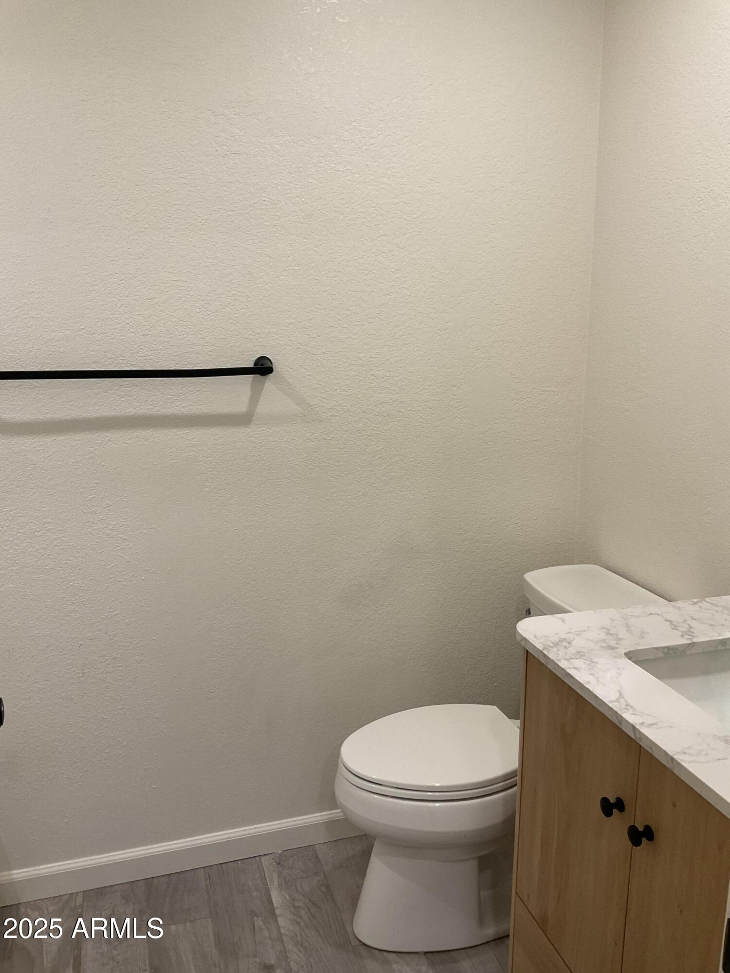 95 North Cooper Road, Unit 75 Chandler, AZ 85225 - Photo 15 of 19 a bathroom with a toilet and a sink